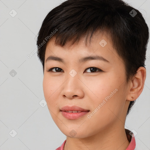 Joyful asian young-adult female with short  brown hair and brown eyes