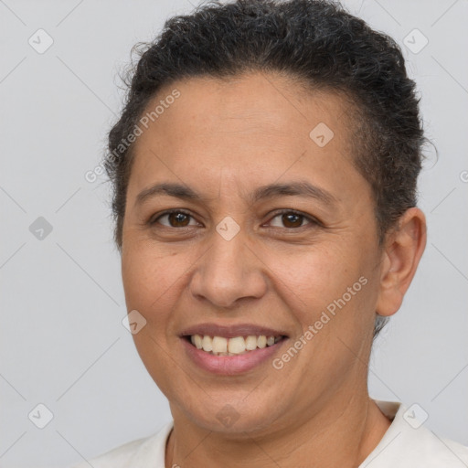 Joyful white adult female with short  brown hair and brown eyes