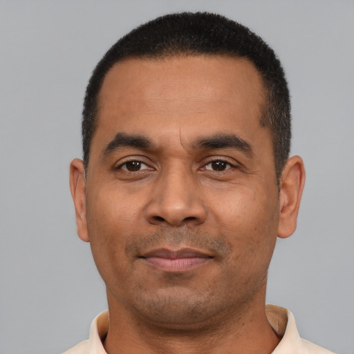 Neutral latino adult male with short  black hair and brown eyes