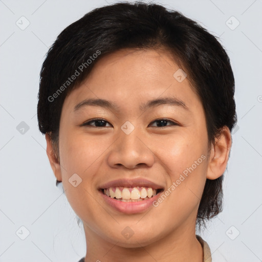 Joyful asian young-adult female with short  brown hair and brown eyes