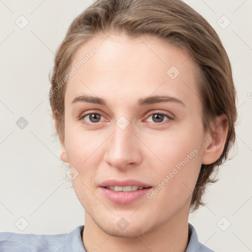 Joyful white young-adult female with short  brown hair and grey eyes