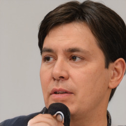 Neutral white adult male with short  brown hair and brown eyes