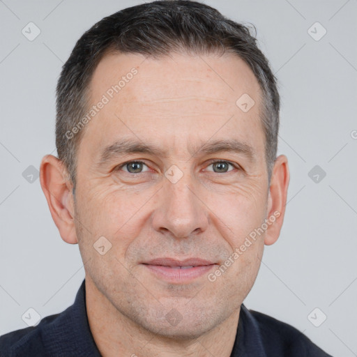 Joyful white adult male with short  brown hair and brown eyes