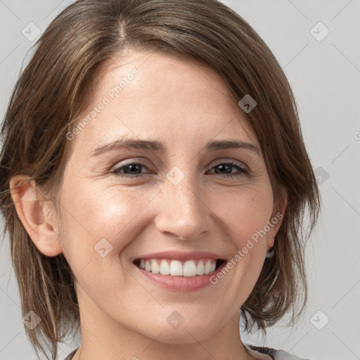 Joyful white young-adult female with medium  brown hair and grey eyes