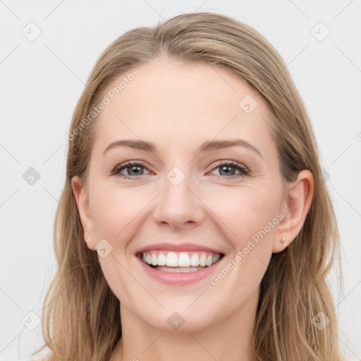 Joyful white young-adult female with long  brown hair and blue eyes