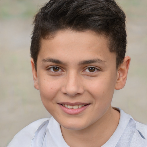 Joyful white child male with short  brown hair and brown eyes