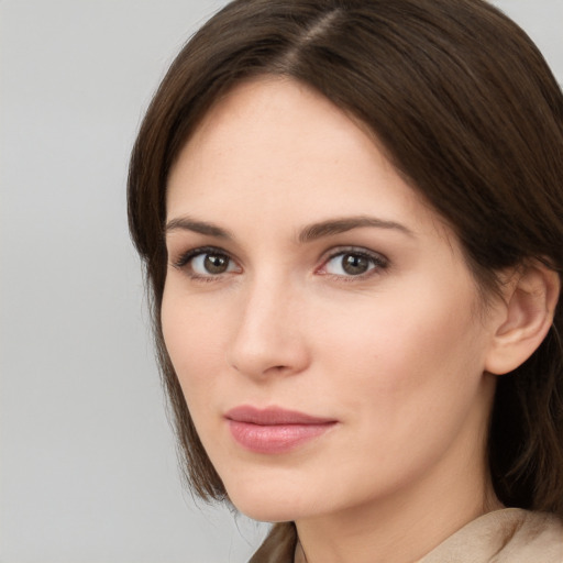 Neutral white young-adult female with medium  brown hair and brown eyes