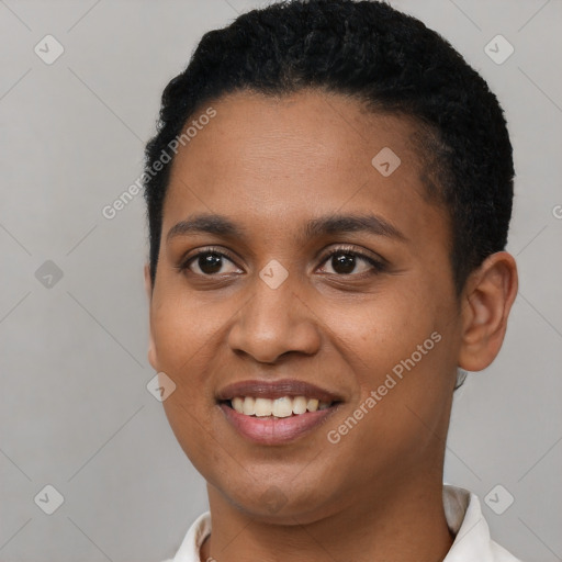 Joyful black young-adult female with short  black hair and brown eyes