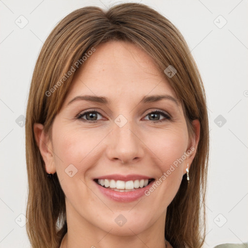 Joyful white young-adult female with medium  brown hair and green eyes