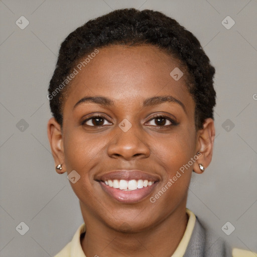 Joyful black young-adult female with short  brown hair and brown eyes