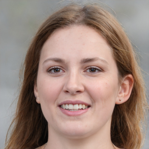 Joyful white young-adult female with medium  brown hair and grey eyes