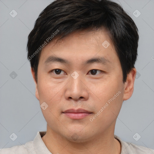 Neutral asian young-adult male with short  brown hair and brown eyes