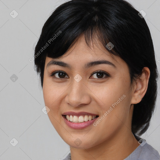 Joyful asian young-adult female with medium  brown hair and brown eyes