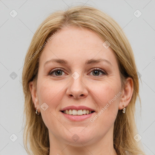 Joyful white young-adult female with medium  brown hair and blue eyes