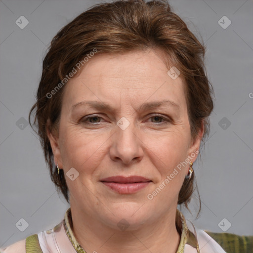 Joyful white adult female with medium  brown hair and blue eyes