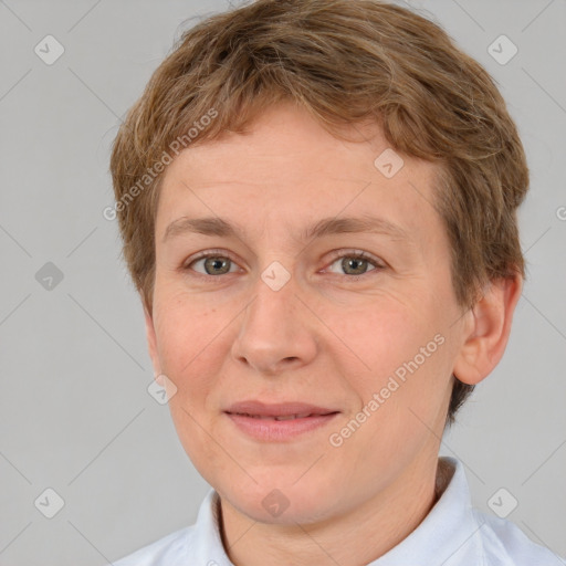 Joyful white adult female with short  brown hair and brown eyes