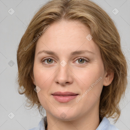 Joyful white young-adult female with medium  brown hair and green eyes