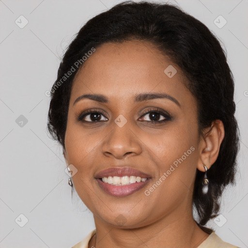 Joyful black young-adult female with long  brown hair and brown eyes