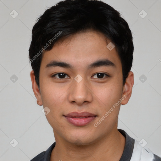 Joyful asian young-adult male with short  black hair and brown eyes