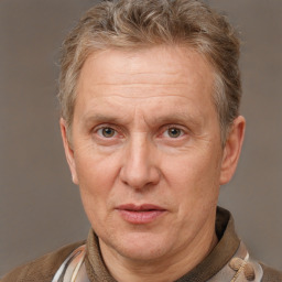 Joyful white middle-aged male with short  brown hair and brown eyes