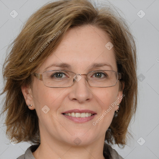 Joyful white adult female with medium  brown hair and blue eyes