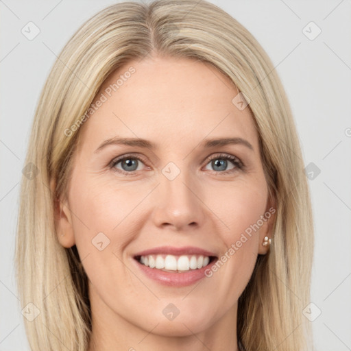 Joyful white young-adult female with long  brown hair and blue eyes