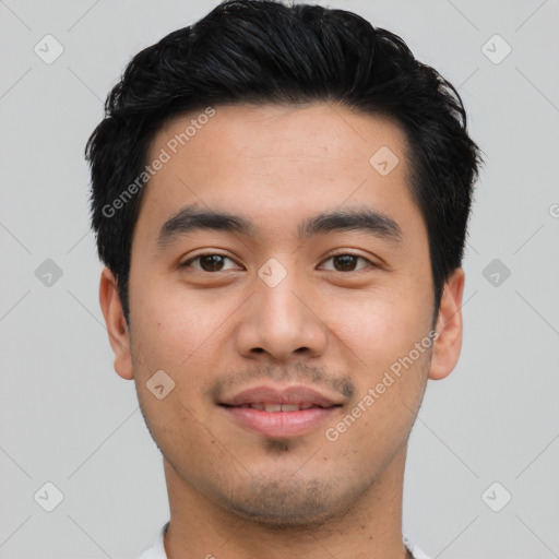 Joyful asian young-adult male with short  black hair and brown eyes