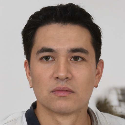 Neutral latino young-adult male with short  black hair and brown eyes