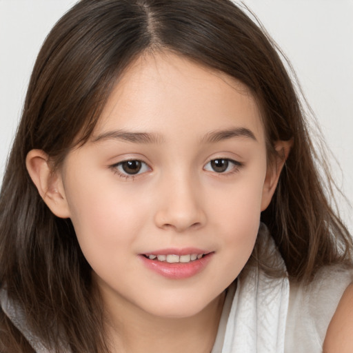 Joyful white child female with long  brown hair and brown eyes