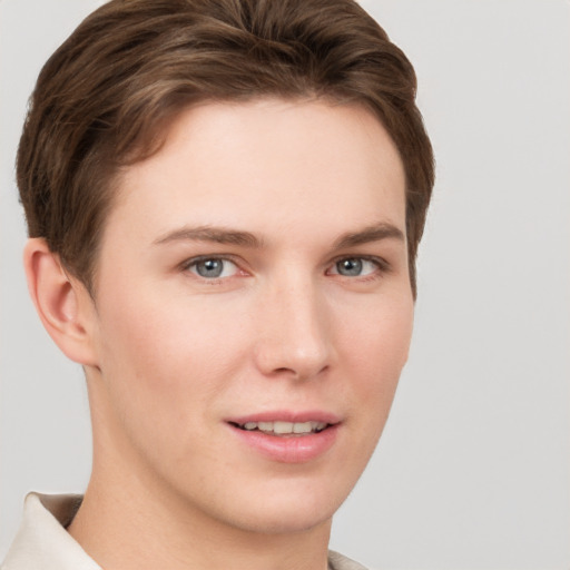 Joyful white young-adult female with short  brown hair and grey eyes