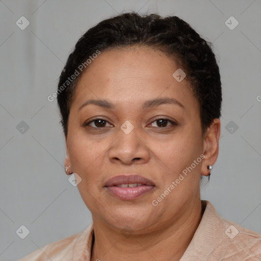 Joyful latino adult female with short  brown hair and brown eyes