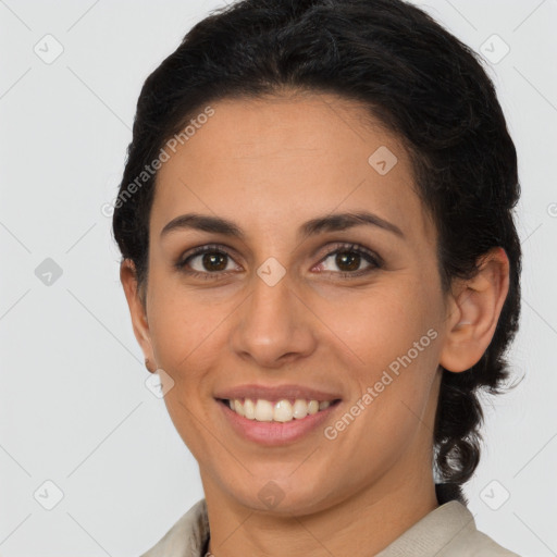 Joyful latino young-adult female with long  brown hair and brown eyes