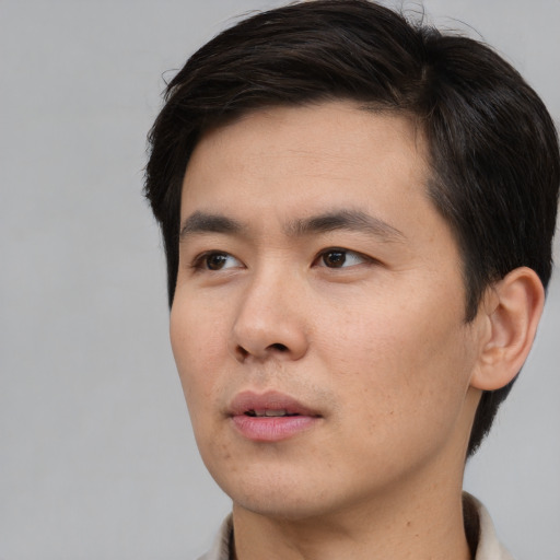 Neutral asian young-adult male with short  brown hair and brown eyes