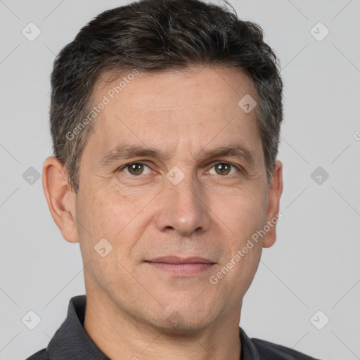 Joyful white adult male with short  brown hair and brown eyes