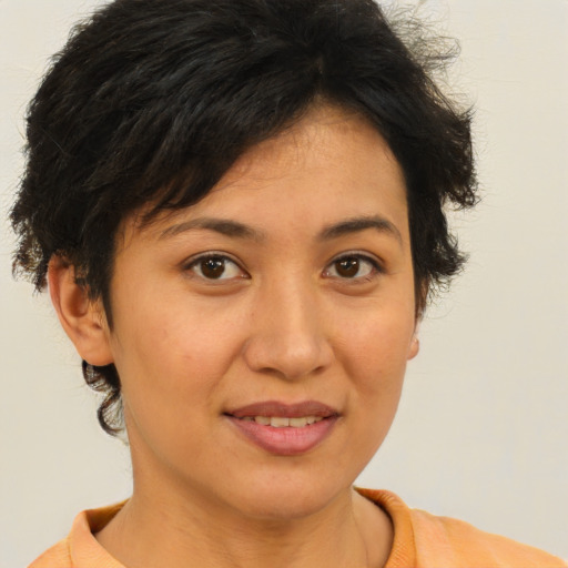 Joyful asian young-adult female with short  brown hair and brown eyes