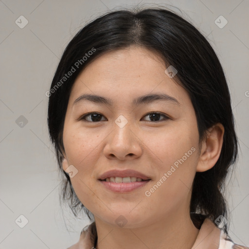 Joyful asian young-adult female with medium  black hair and brown eyes