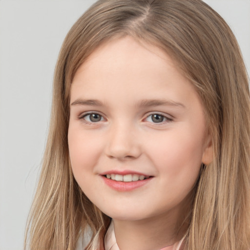 Joyful white child female with long  brown hair and brown eyes