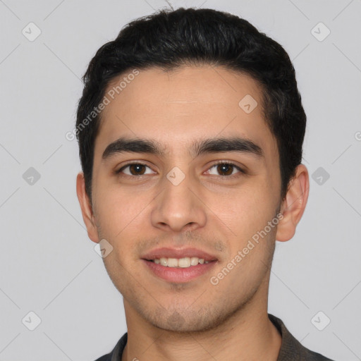 Joyful white young-adult male with short  black hair and brown eyes