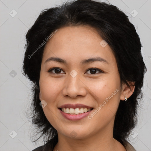 Joyful latino young-adult female with medium  brown hair and brown eyes