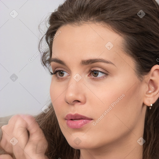 Neutral white young-adult female with long  brown hair and brown eyes