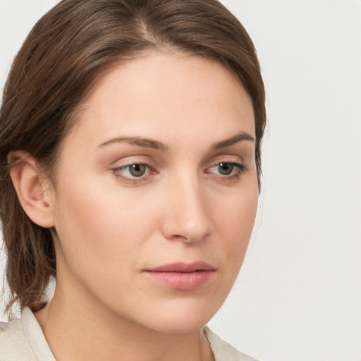 Neutral white young-adult female with medium  brown hair and green eyes