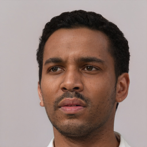 Neutral black young-adult male with short  black hair and brown eyes