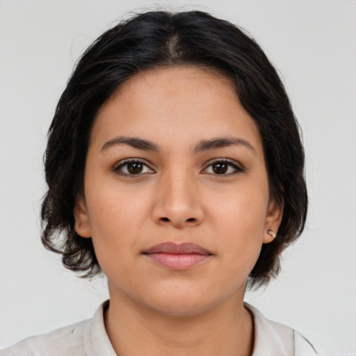 Neutral latino young-adult female with medium  brown hair and brown eyes