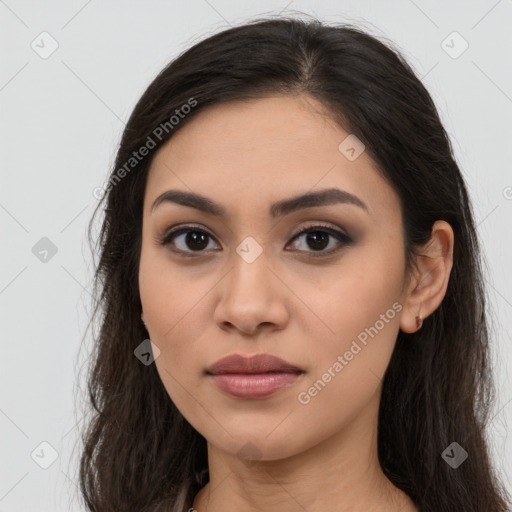 Joyful latino young-adult female with long  brown hair and brown eyes