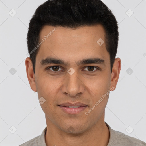 Joyful white young-adult male with short  black hair and brown eyes