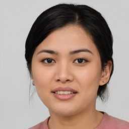 Joyful asian young-adult female with medium  black hair and brown eyes