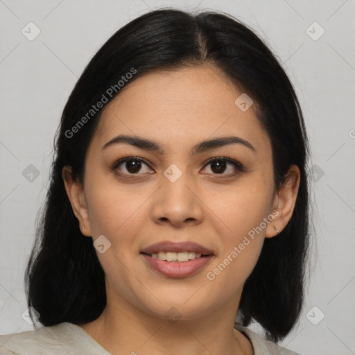 Joyful latino young-adult female with medium  brown hair and brown eyes