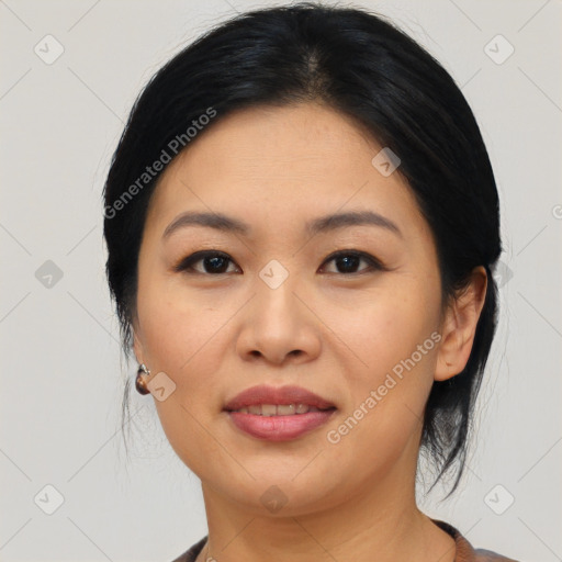 Joyful asian young-adult female with medium  black hair and brown eyes