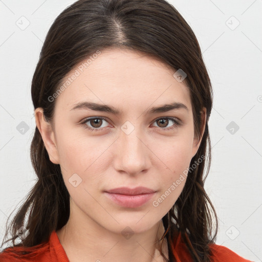 Neutral white young-adult female with long  brown hair and brown eyes