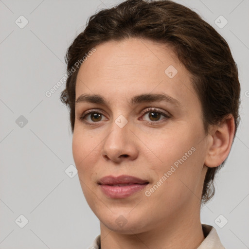 Joyful white young-adult female with short  brown hair and green eyes